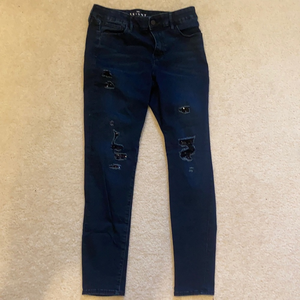 Distressed embellished jeans